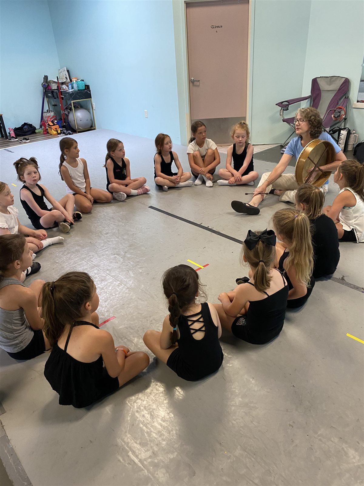 Young dancers learning about Irish music and tradition in class